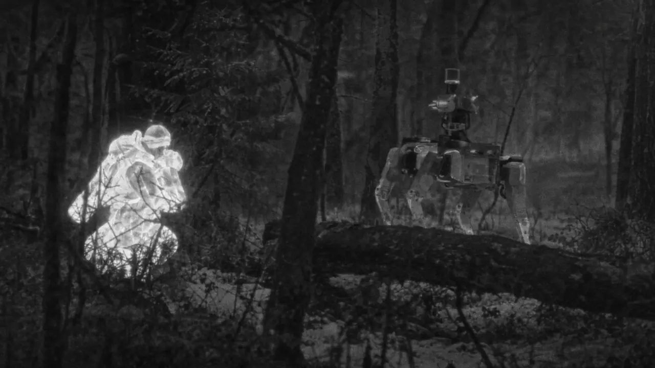 Thermal view: a crouching person glows white behind a fallen log while a quadruped robot searches nearby.